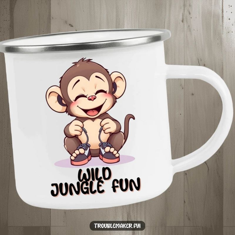 Funny camping mug showcasing a giggling monkey tying tiny shoelaces together, perfect for outdoor adventures and prank humor.
