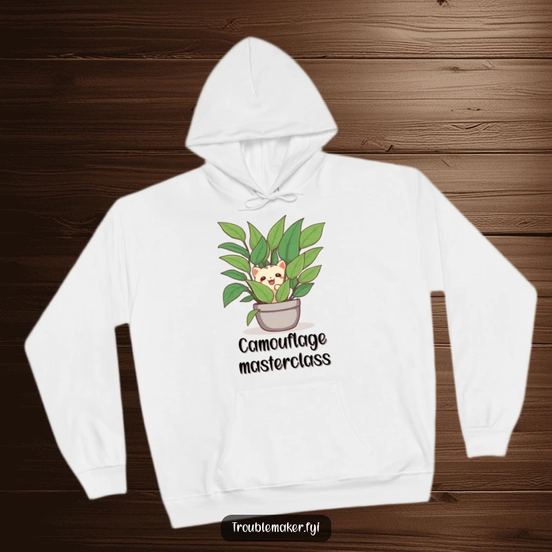 Funny hoodie graphic of a creature peeking out from behind a verdant houseplant, a humorous representation of playful hiding.