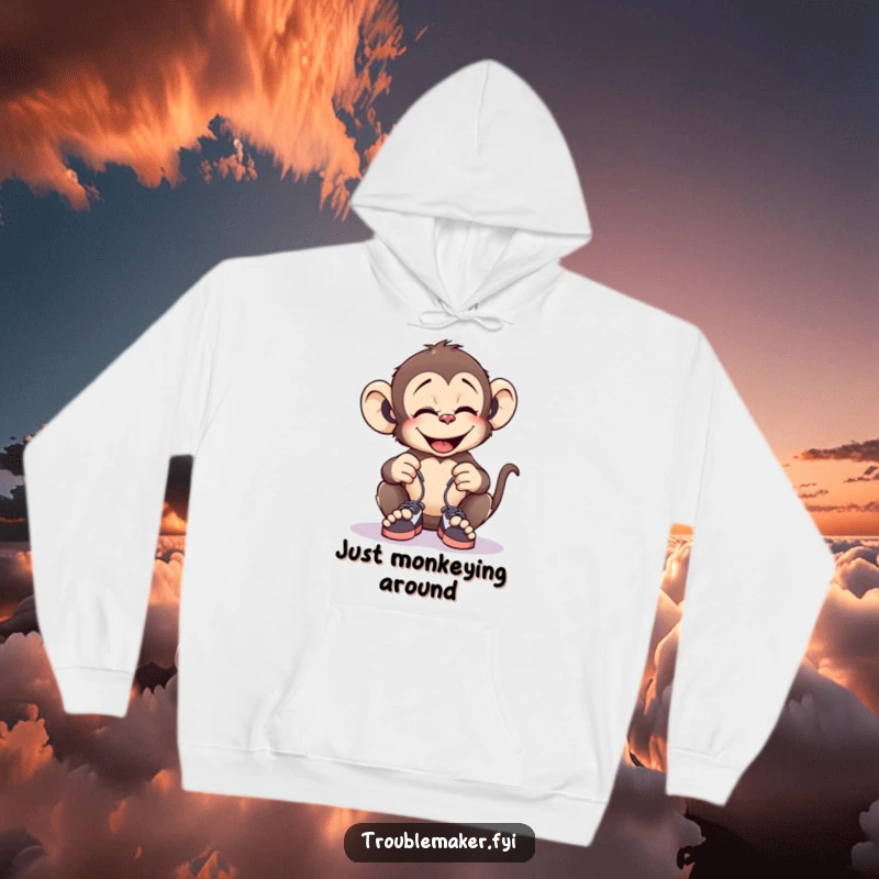 Funny hoodie with a giggling monkey tying tiny shoelaces together, offering warmth and a humorous prank theme.
