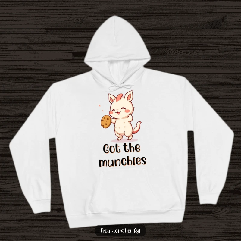 Funny hoodie design of a creature grooving enthusiastically with a stolen cookie, a humorous representation of festive indulgence.
