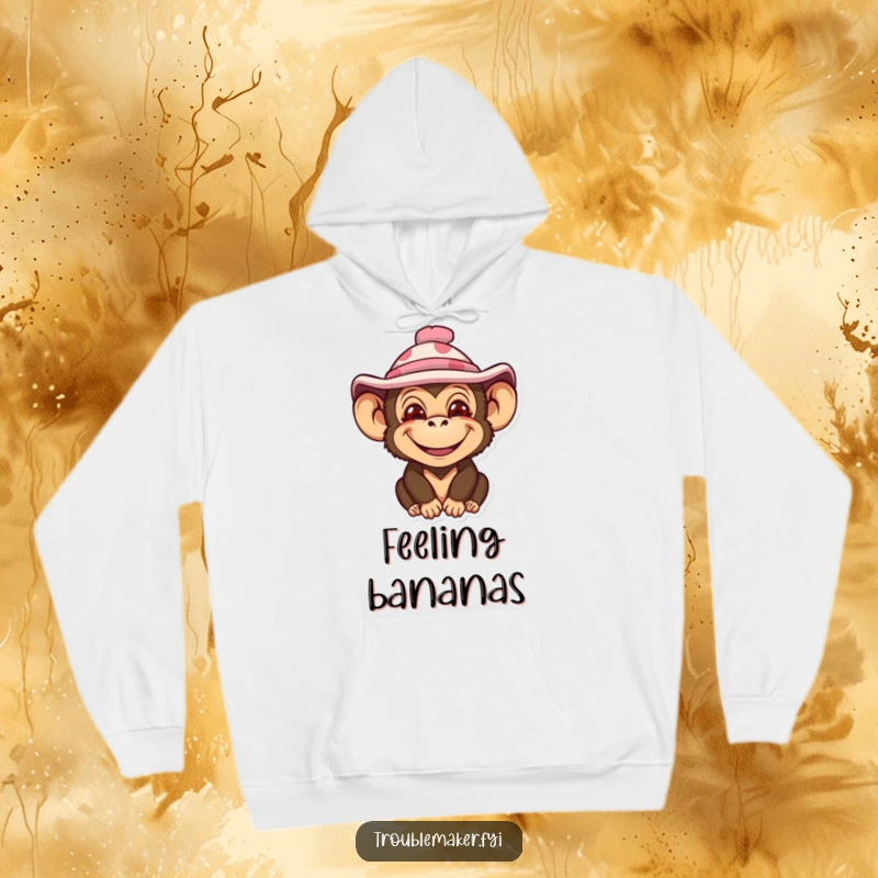 Funny hoodie with an impish monkey character sporting a wide smile and an amusingly silly hat, perfect for cozy laughs.