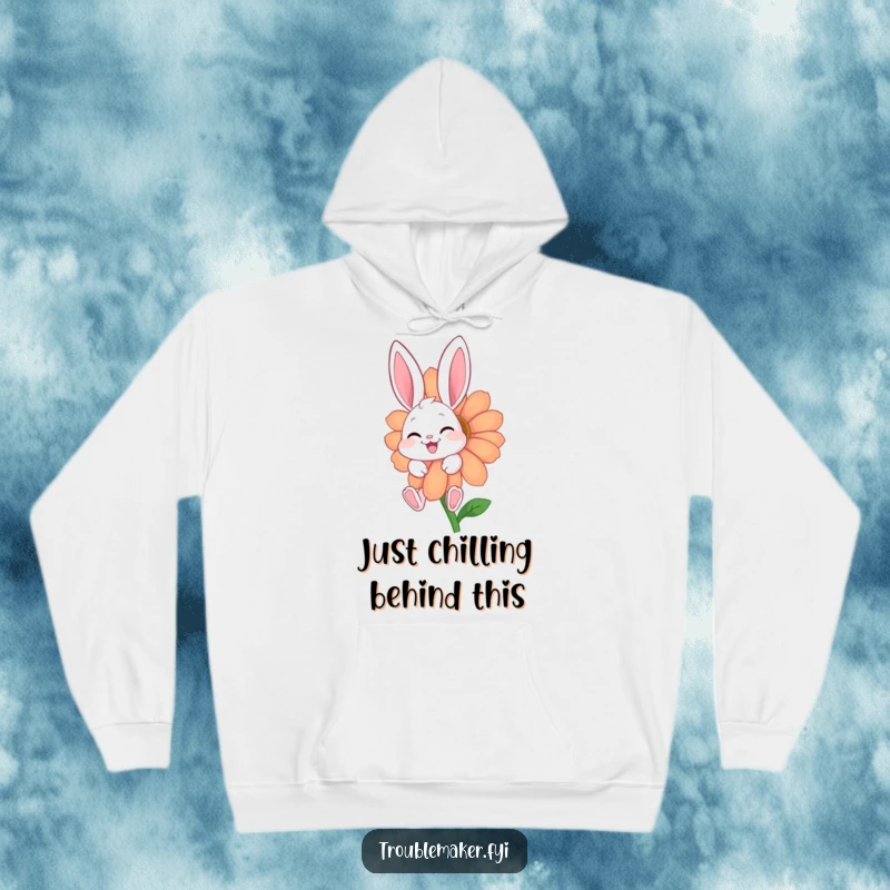 Funny hoodie with a giggling bunny character hidden behind a big, cheerful flower, offering warmth and a playful vibe.