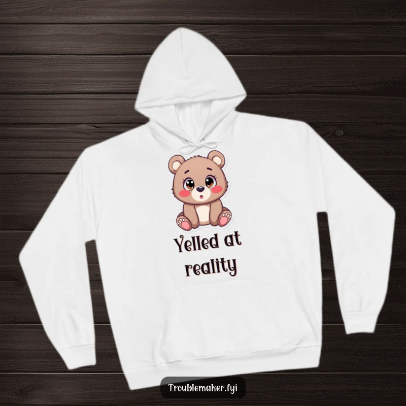 Funny Hoodie depicting a small bear cub with enormous, saucer-like eyes, frozen in a moment of hilarious surprise and wonder.