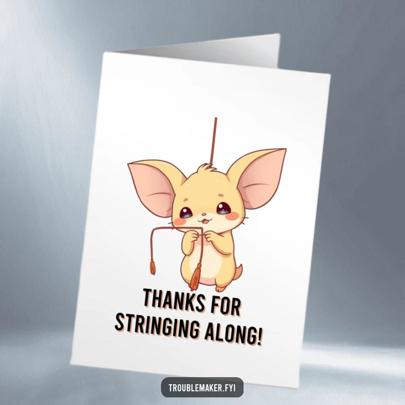 Funny Free Printable Thank You Card: A creature with oversized ears joyfully playing with a dangling string, sending thanks with delight.