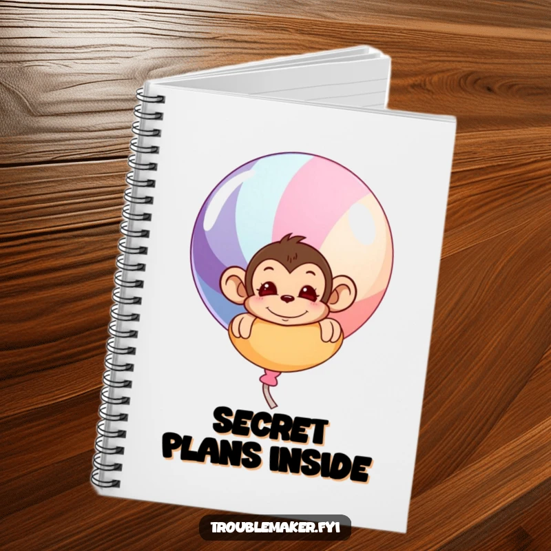Funny notebook with a mischievous monkey peeking from behind a large, colorful balloon, designed for jotting down fun ideas.