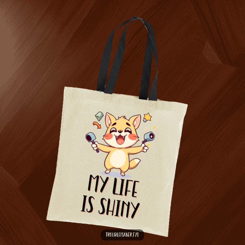 Funny Tote Bag with a trouble maker animal juggling various shiny objects, perfect for carrying everyday items stylishly.
