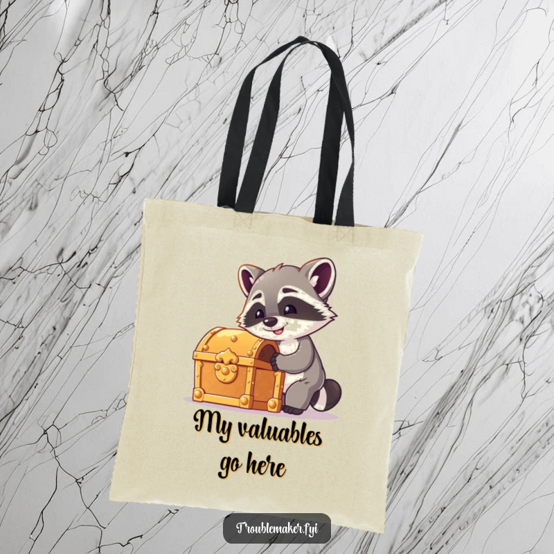 Funny raccoon tote bag with a cheeky raccoon attempting to pick a treasure chest lock, perfect for carrying essentials with adventurous humor.