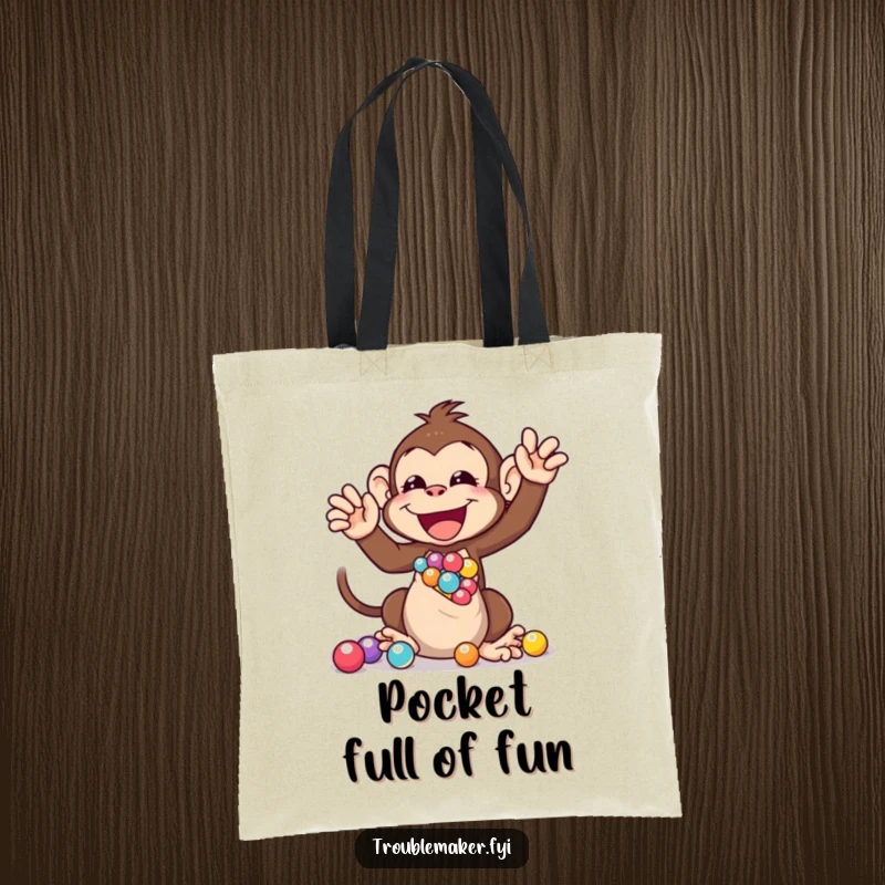 Funny tote bag design of a monkey joyfully shaking a bag of marbles, perfect for carrying items with a splash of playful energy.